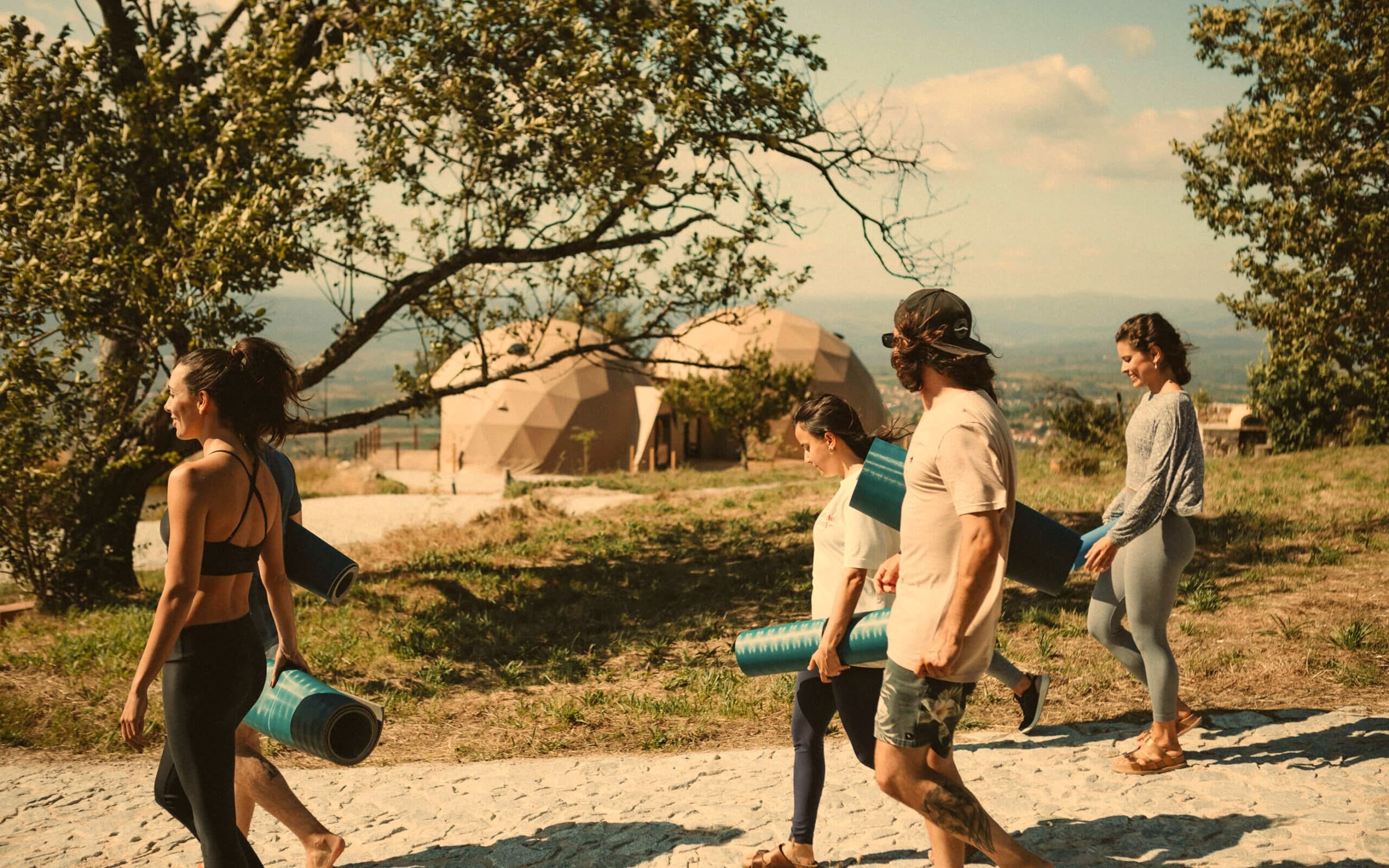People laughing together outdoors, connecting and enjoying real-life experiences